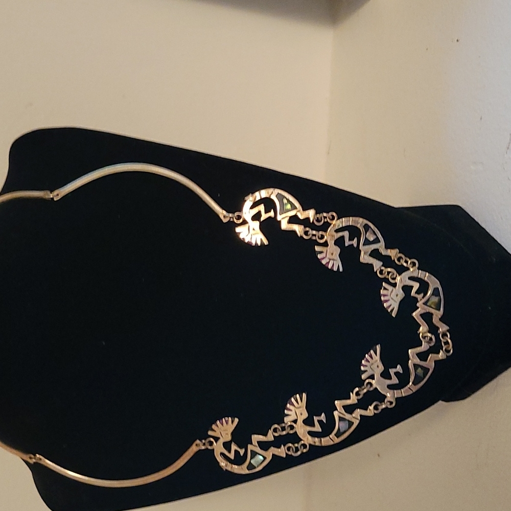 Silver kokopelli necklace.